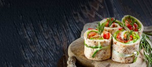 Fresh colorful sushi in a serving platter on black background