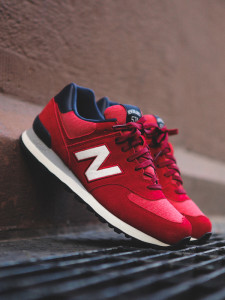A pair of red New Balance shoes
