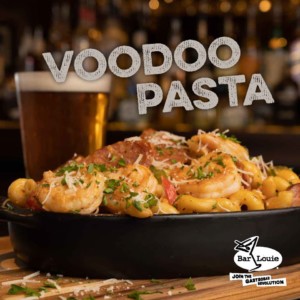 Bowl of Bar Louie Voodoo pasta with a beer