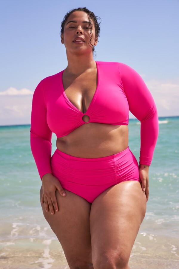 Woman in magenta swimsuit