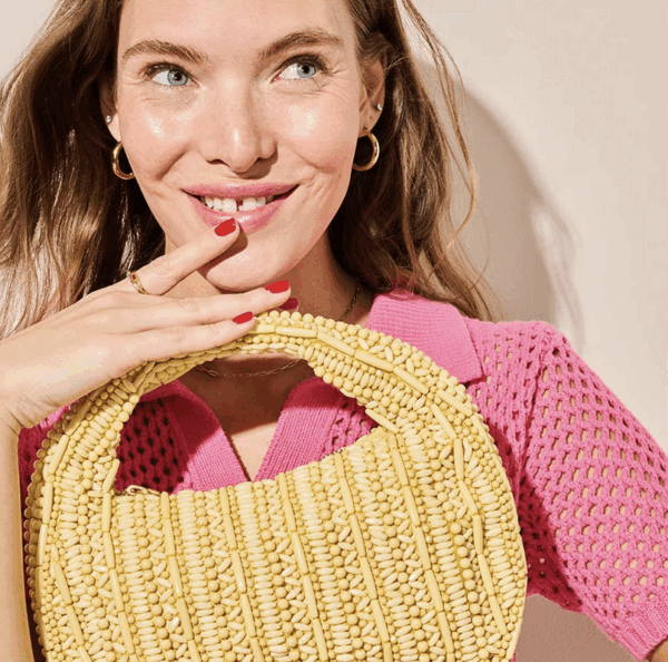 Woman with woven handbag