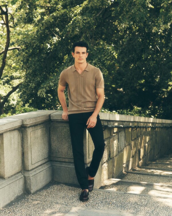 Man with tan shirt and black slacks