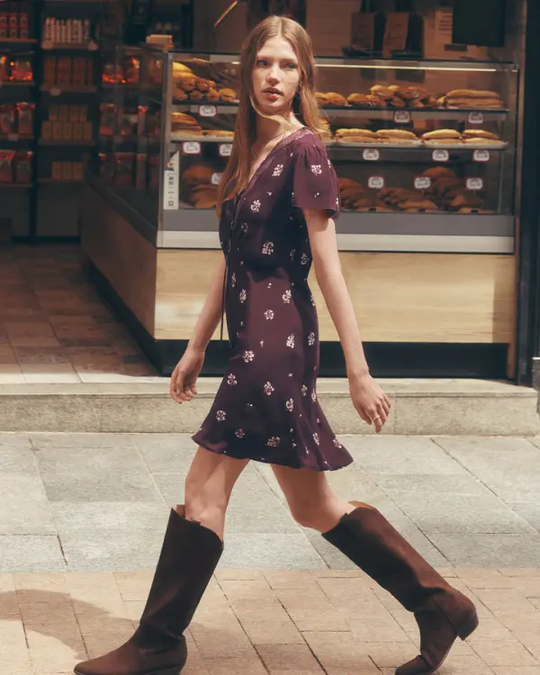 Girl wearing dress with black boots