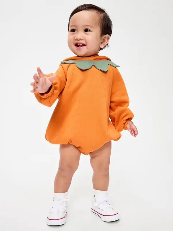 toddler in pumpkin suit